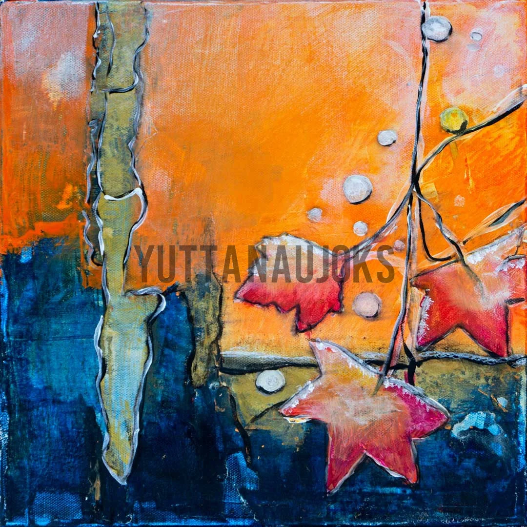 orangener und blauer Hintergrund mit einem Ast mit Blättern im Vordergrund